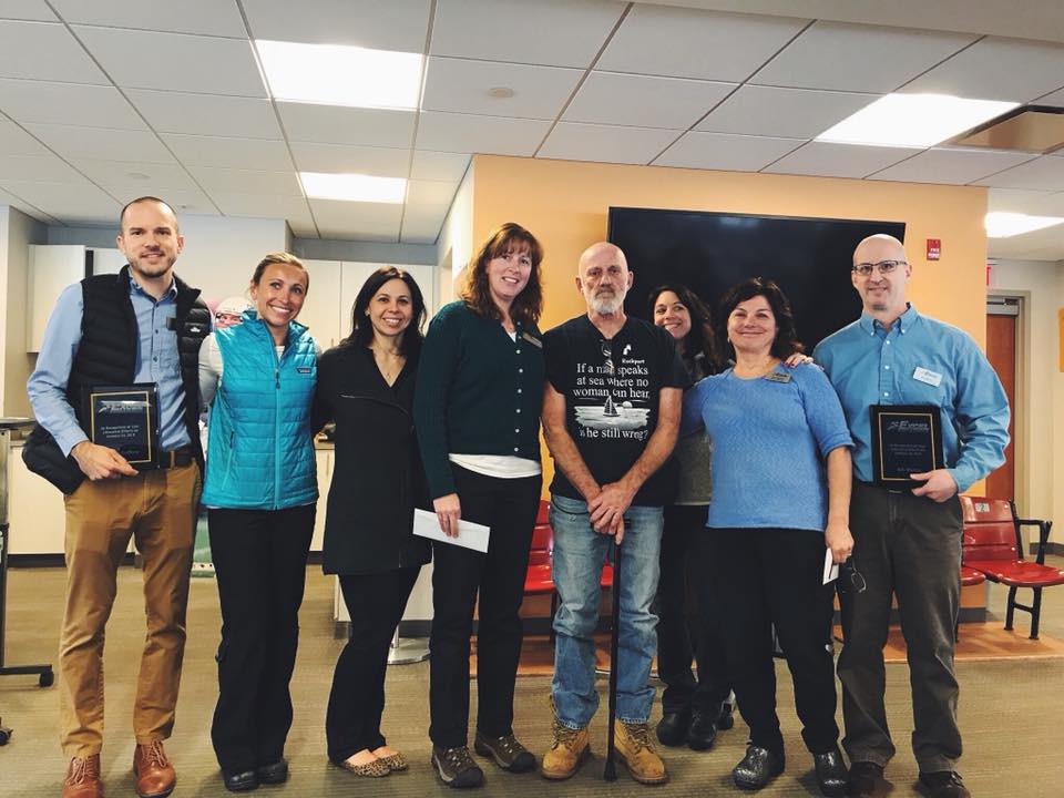 Physical Therapists standing with plaques during a recognition ceremony